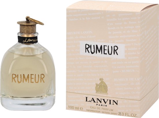 Glazen parfumflesje met gouden letters "RUMEUR", naast een crèmekleurige verpakking met "RUMEUR".