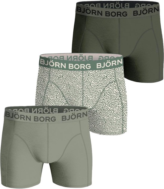 Drie boxershorts van Björn Borg in het groen. Eén met print, twee effen.