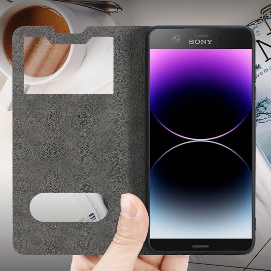 Coque Cadorabo compatible avec Sony Xperia XZ1 COMPACT en NOIR COMET - Coque de protection avec fermeture magnétique, fonction support et 2 fenêtres de visualisation