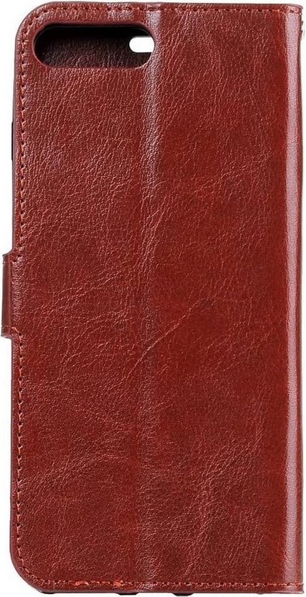 Étui livre marron pour téléphone, fermé, avec fermoir magnétique.