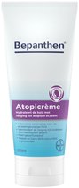 Witte Bepanthen Atopicrème tube met paars en blauw label.
