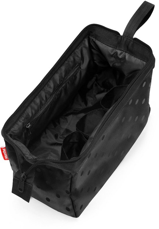 Open zwarte toilettas met glanzende stippen, interieur met vakken en ritssluiting.