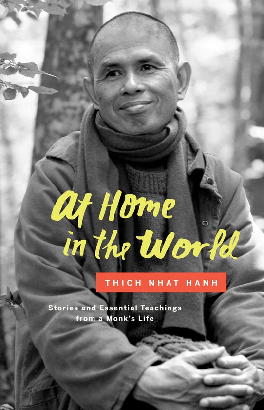 Zwart-wit portret van Thich Nhat Hanh, met de tekst 'At Home in the World', 'Stories and Essential Teachings from a Monk's Life'.