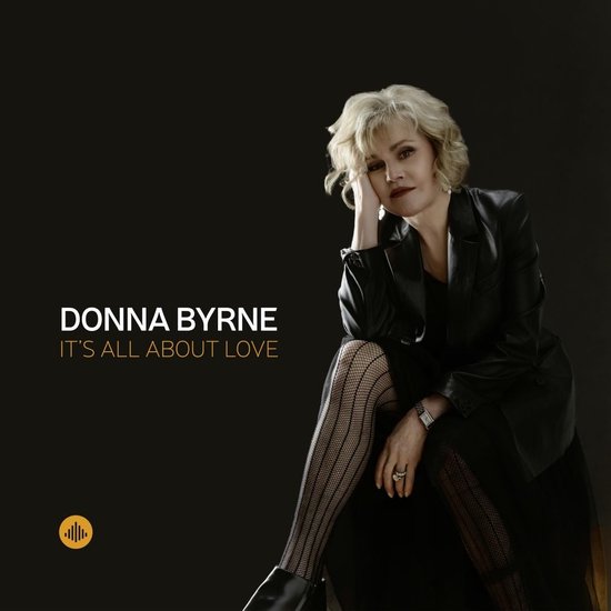 Donna Byrne, "It's All About Love" albumcover met een vrouw in zwart met visnetkousen.
