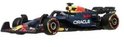 Voiture de course F1 Hot Wheels Oracle Red Bull Racing RB20, bleu foncé, rouge et jaune, sur fond blanc.