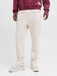 Man draagt crème joggingbroek, close-up.
