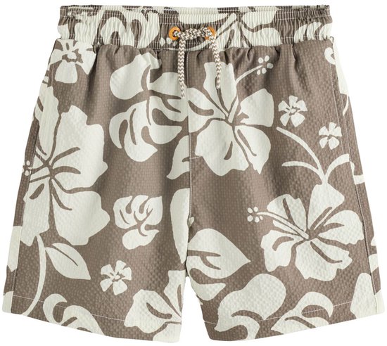 Bruine zwemshort voor kinderen met een grote witte hibiscusprint en een elastische tailleband.