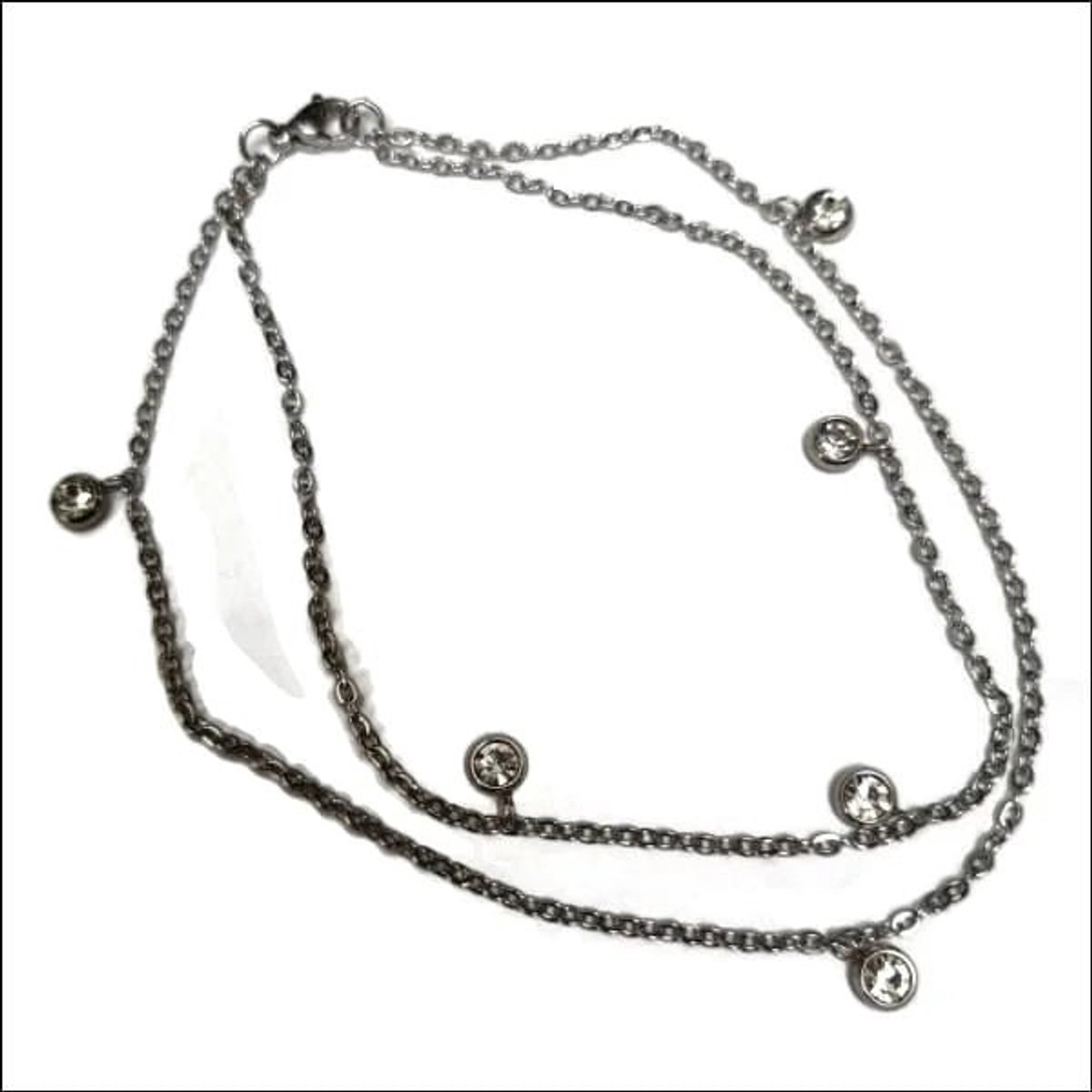 Aramat Jewels | Enkelbandjes | Dubbel Enkelbandje met Zirkonia Steentjes | Transparant | |3mm | Staal | Volwassenen | Verkleurd niet