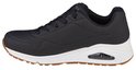 Zwarte Skechers Uno dames sneaker met witte zool en bruin accent op de zool.