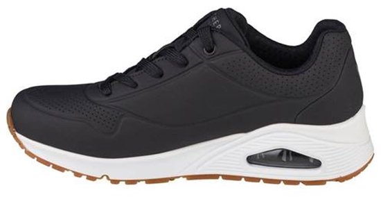 Zwarte Skechers Uno dames sneaker met witte zool en bruin accent op de zool.