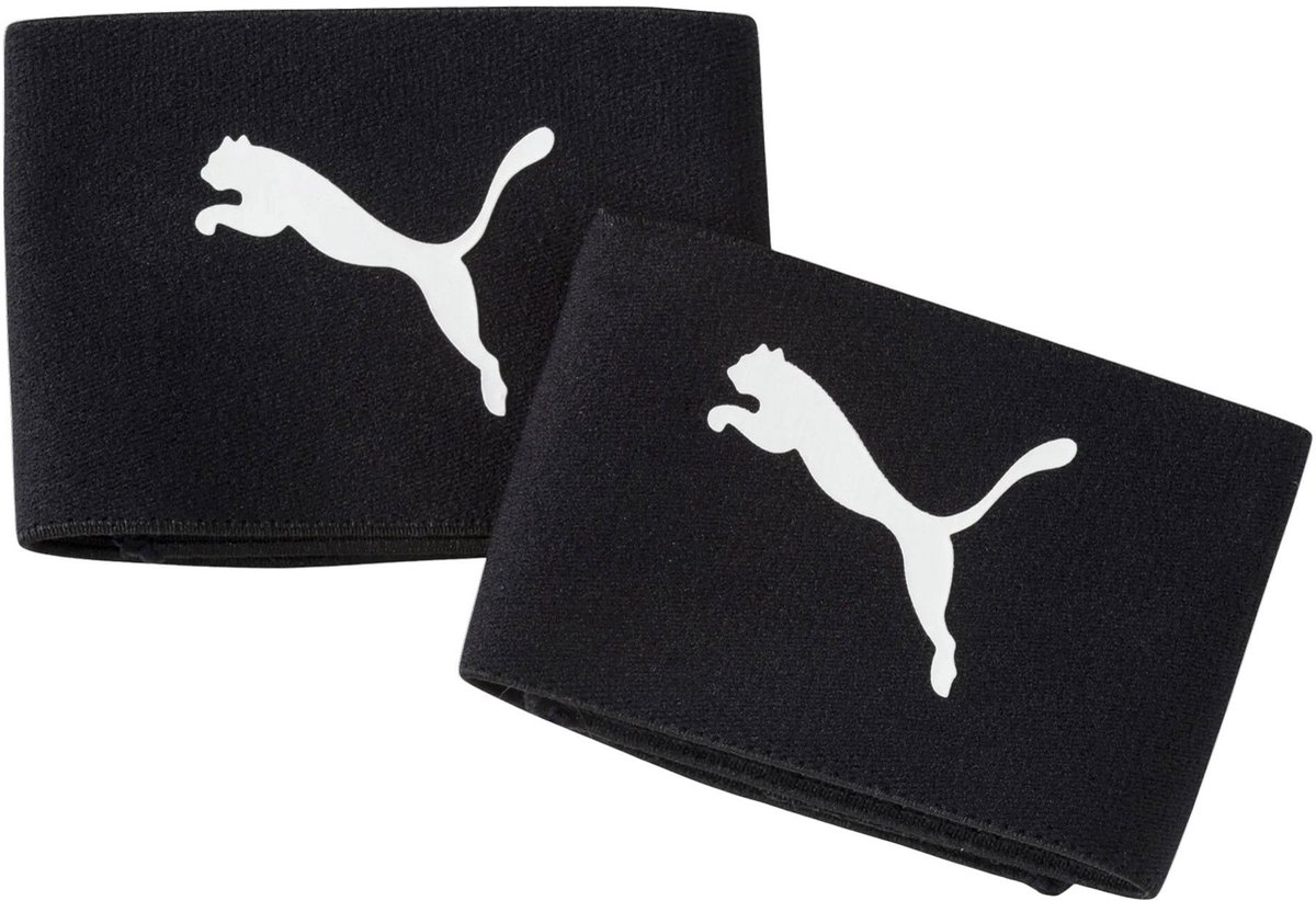 Puma Sock Stoppers Wide in zwart-wit, met klittenband, breed model, set van twee, afmeting 26 x 6,5 cm.