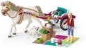 Wit paard, blonde amazone, hondje en picknickspullen op een kleed.