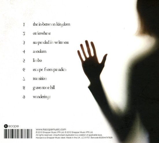 Ombre floue d'une main sur un mur, avec liste des pistes. Label 'Kscope'.