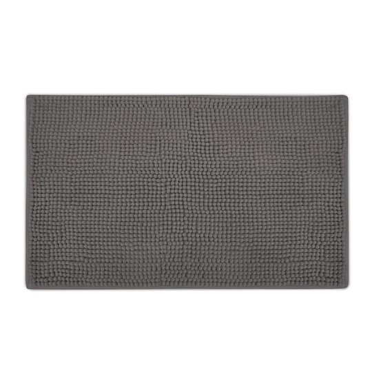 Grijze badmat met bobbelstructuur, plat neergelegd.