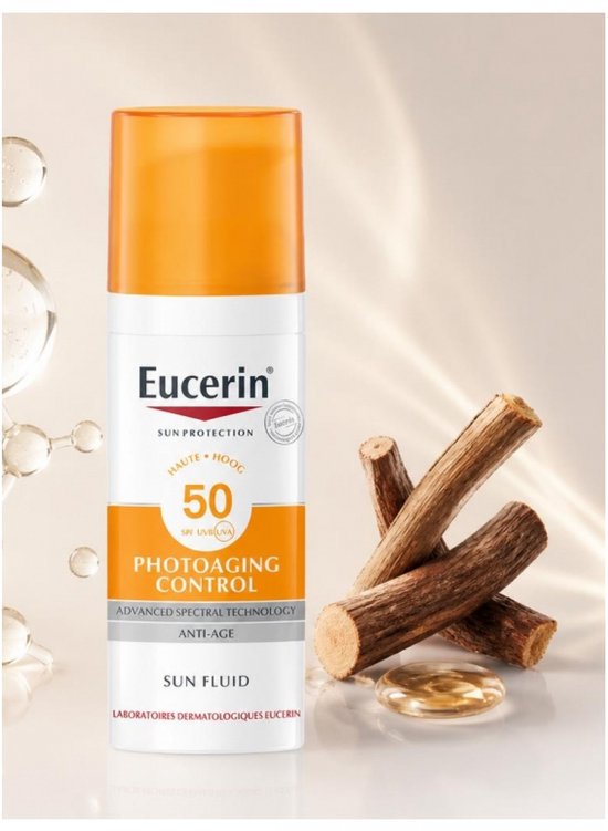 Eucerin zonnebrandcrème met SPF 50 in witte fles met oranje dop. Naast de fles liggen takken en een druppel.