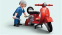 Playmobil monteur in blauw uniform met gereedschap bij rode Vespa scooter.
