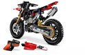 Lego Technic Ducati motorfiets met onderdelen ernaast, rood met zwarte en gouden details. Nummer 222.