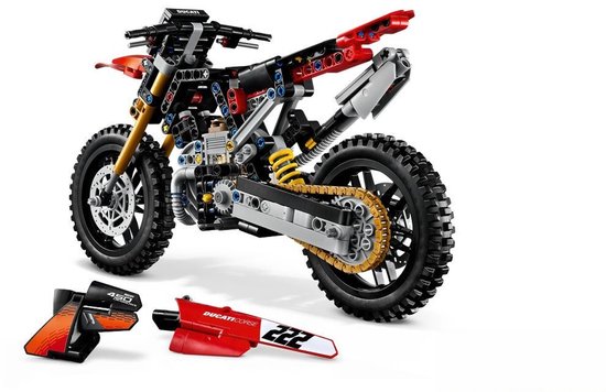 Lego Technic Ducati motorfiets met onderdelen ernaast, rood met zwarte en gouden details. Nummer 222.