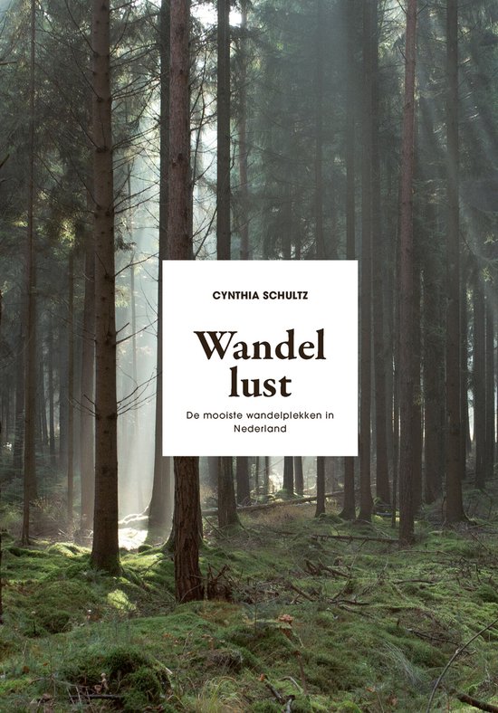 Boek 'Wandellust' met de tekst 'De mooiste wandelplekken in Nederland' in een bosrijke omgeving.