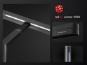 Close-up van een zwarte bureaulamp met dubbele LED's. "ScreenBar Max" en "red dot winner 2026" logo's zichtbaar.