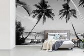 Behang - Fotobehang Palmbomen en ligstoelen op het strand van Boracay - zwart wit - Breedte 360 cm x hoogte 240 cm