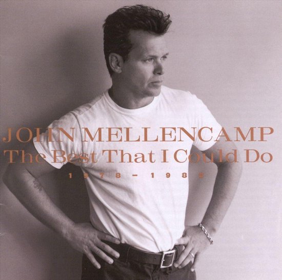 John Mellencamp, The Best That I Could Do, 1978-1988 albumhoes, man in wit t-shirt en donkere broek.