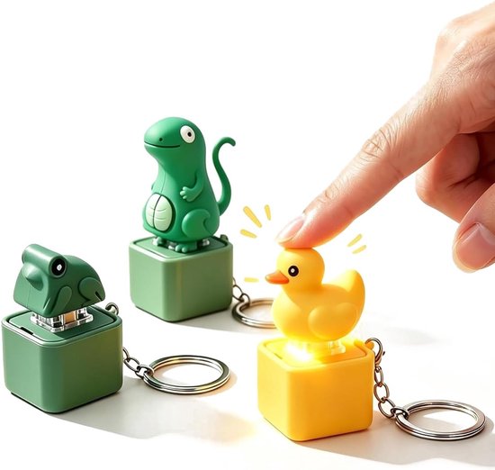 Drie fidget-sleutelhangers in de vorm van een dinosaurus, kikker en eend, die oplichten bij indrukken.