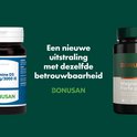 Twee flessen Bonusan supplementen op een groene achtergrond.