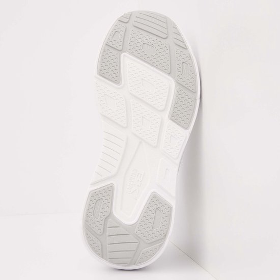 Witte sneakerzool met grijs patroon.