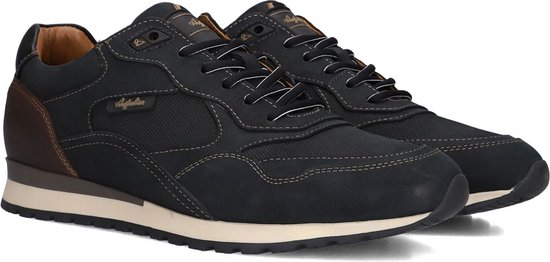 Twee donkerblauwe sneakers met bruine hiel en witte stiksels.