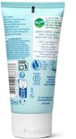 Achterkant van Happy Earth dagcrèmetube met ingrediëntenlijst, 0% parfum en 100% natuurlijke claims.