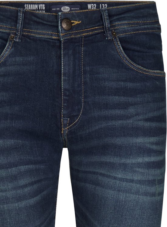 Donkerblauwe Petrol Industries spijkerbroek met wassing en oranje stiksels, maat W32 L32.