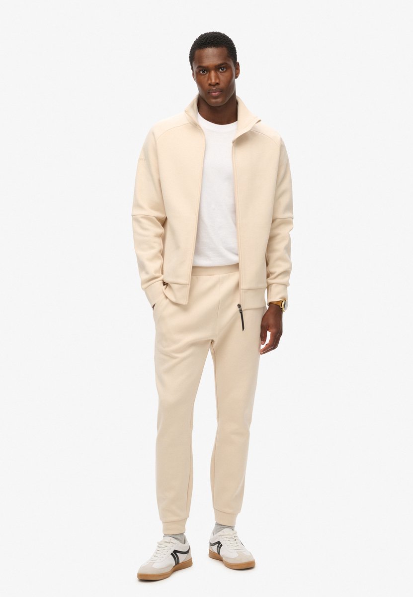 Superdry Tech joggingbroek met taps toelopende pijpen Heren Broeken Beige