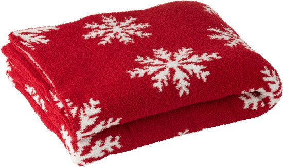 Opgevouwen rood plaid met witte sneeuwvlokken.