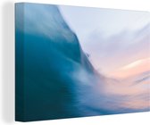Canvas Schilderij Zonsondergang achter de golven - 90x60 cm - Wanddecoratie