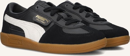 Zwarte Puma Palermo sneakers met witte Puma-streep en gummi zool.