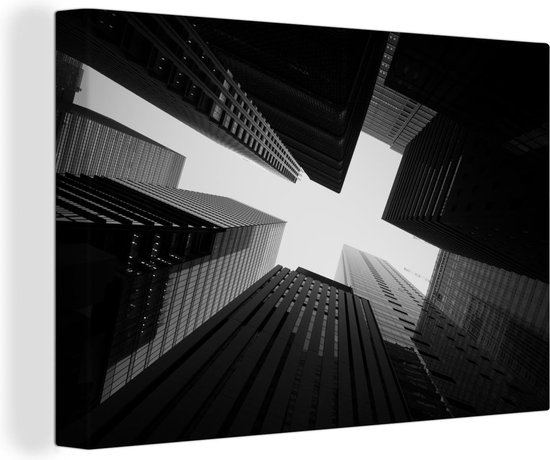 Canvas Schilderij Kantoorgebouwen in Tokio vanuit laag perspectief in zwart-wit - 120x80 cm - Wanddecoratie