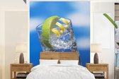 Behang - Fotobehang Gin tonic met een blauwe lucht - Breedte 190 cm x hoogte 260 cm