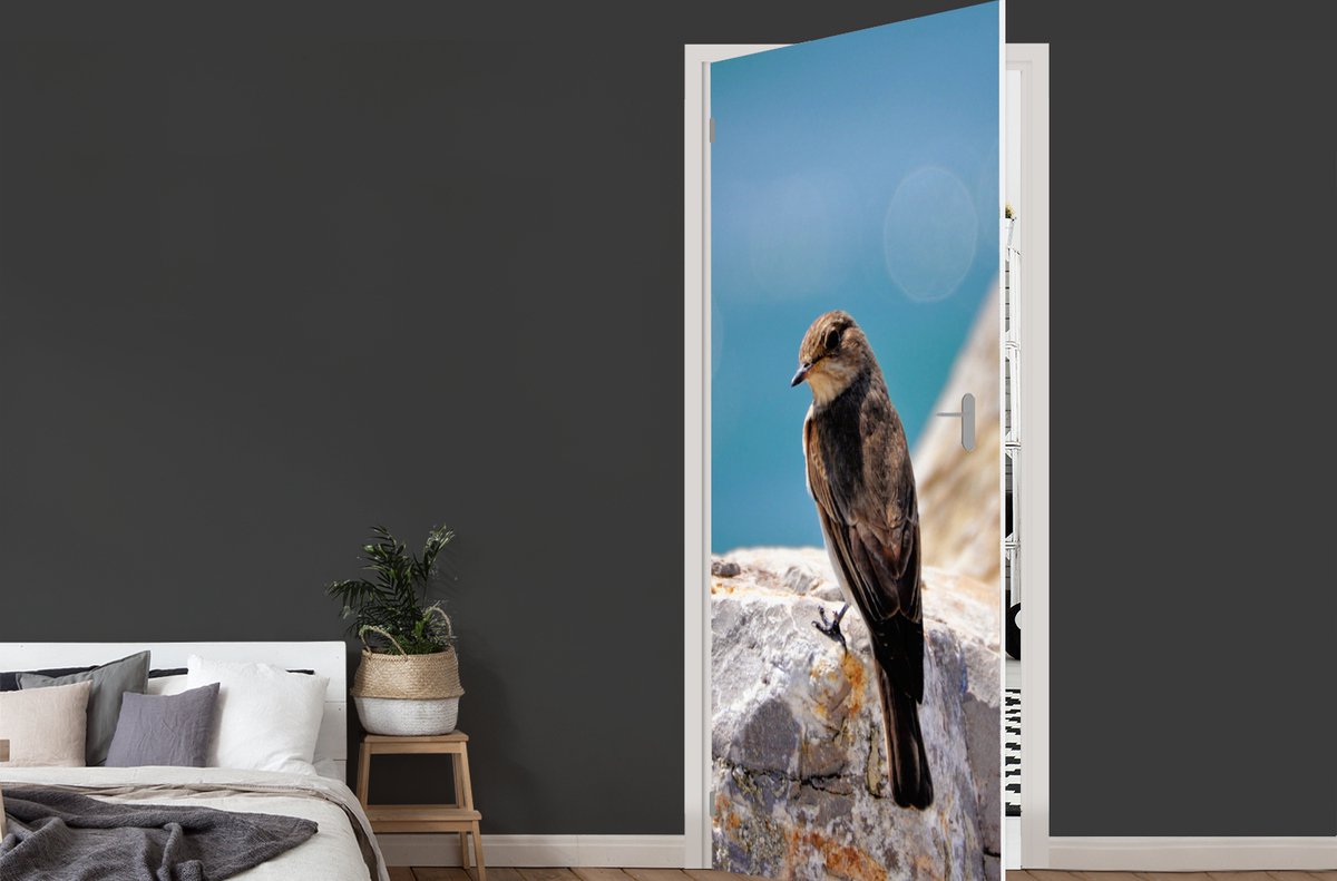 Afbeelding van product StickerSnake  Deursticker Rotsmus op een rots bij de zee - 90x235 cm - Deurposter