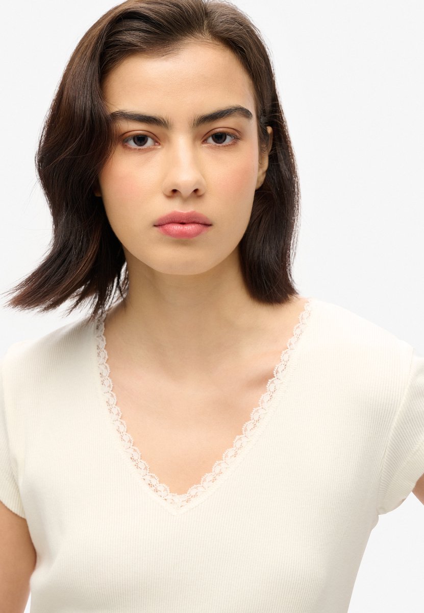 Superdry Athletic Essentials top met V-hals en kanten rand Dames Tops Creme