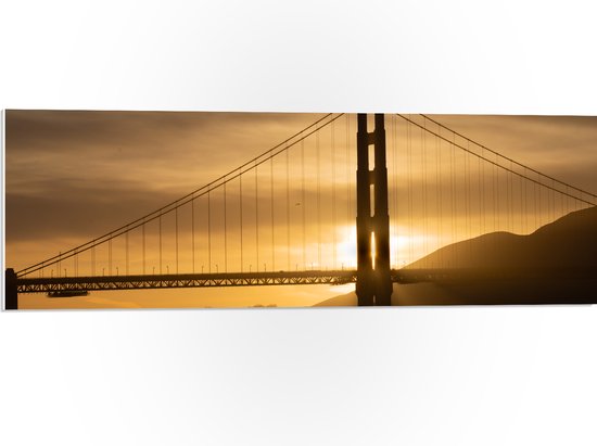 PVC Schuimplaat - Zonsondergang achter Hangbrug Golden Gate Bridge - 90x30 cm Foto op PVC Schuimplaat (Met Ophangsysteem)