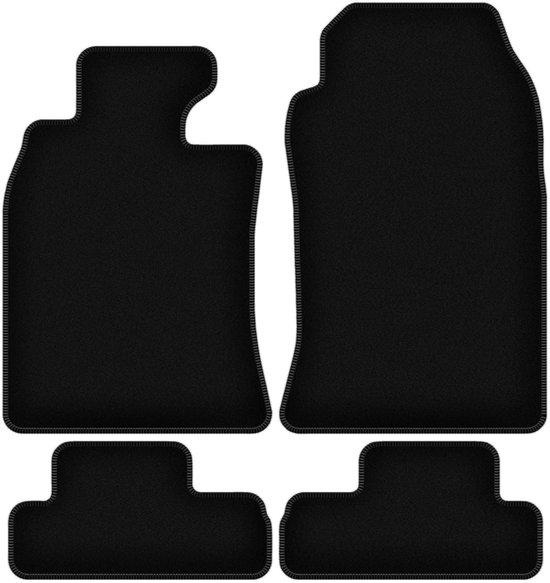 Ensemble de quatre tapis de sol de voiture noirs en velours avec des passepoils gris.
