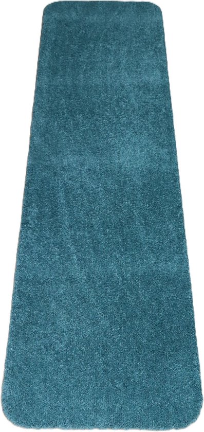 Blauwgroene badmat met afgeronde hoeken, zacht textiel.