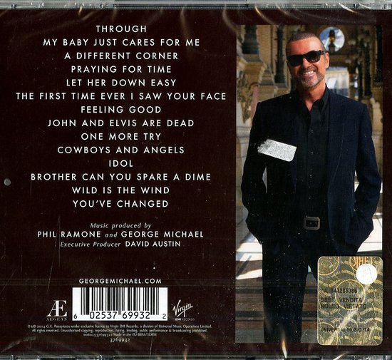 George Michael in zwart pak met zonnebril. Tracklist en cd-informatie zichtbaar. "GEORGE MICHAEL.COM"