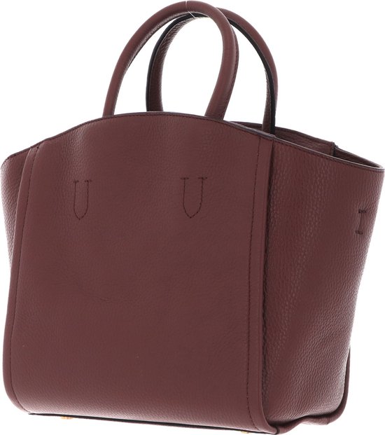 Sac à main en cuir marron, vu de trois quarts avant, avec deux poignées et coutures en U.