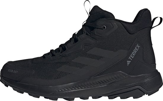 Chaussure de randonnée mi-haute noire avec trois bandes et logo 'TERREX' sur le côté. 'RAIN.RDY' sur le bout.