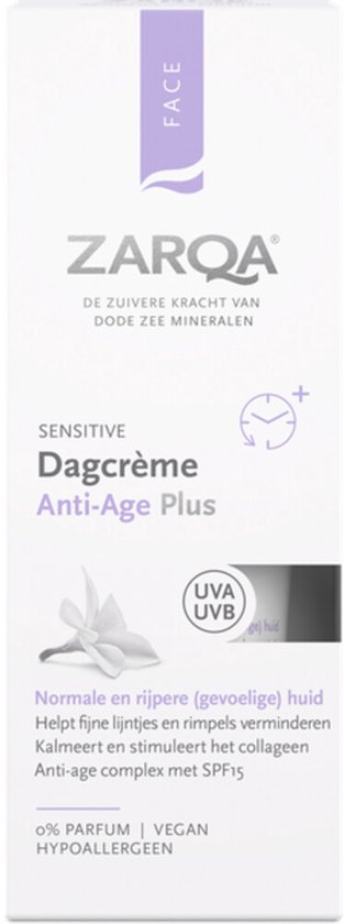 Doos met ZARQA gezichtscreme Anti-Age Plus SPF15. Witte verpakking met paarse accenten en bloemafbeelding. Voor normale/rijpe huid.