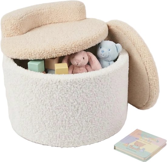 Pouf enfant blanc peluche ouvert avec couvercle crème, rempli de peluches et de blocs, un petit livre à côté.