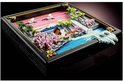 LEGO-landschap met Japanse kersenbloesems, rivier, brug en bergen, in een zwarte lijst.