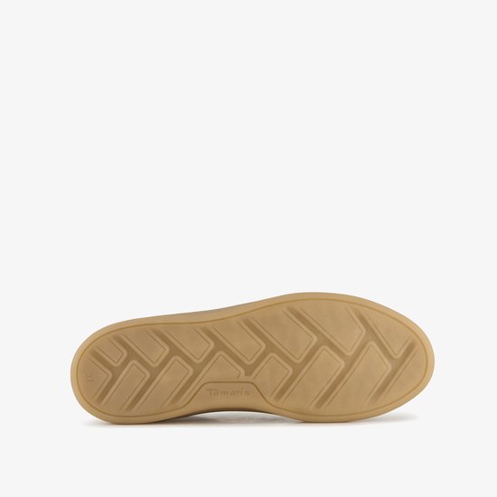 Onderkant van een beige Tamaris sneaker met panterprint en een bruine loopzool met profiel.